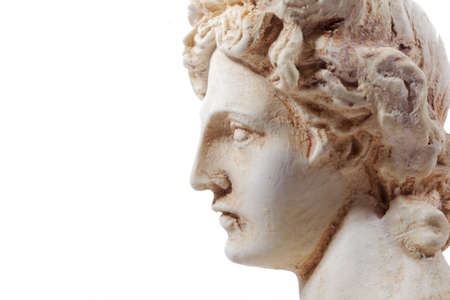 古代ギリシャのアポロンのミニチュア彫刻。石膏像 ミロ ヴィーナス 胸像。光、太陽、真実と予言
